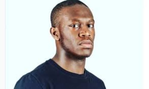 Deji Olatunji in a black t-shirt